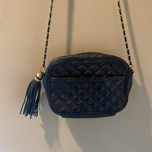 Paradox black leather crossbody or shoulder bag.